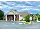 Brick clubhouse exterior showcasing professional landscaping and convenient parking at 101 Keswick Ln, Mooresville, NC 28117