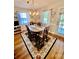 Bright dining room featuring chandelier, rug, and large windows with natural light at 101 Keswick Ln, Mooresville, NC 28117