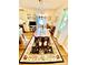 Bright dining room featuring chandelier, rug, and large windows with natural light at 101 Keswick Ln, Mooresville, NC 28117