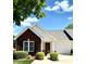 Charming single-story home with brick accents, green shutters, and a well-manicured lawn on a sunny day at 101 Keswick Ln, Mooresville, NC 28117