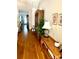 Elegant hallway with hardwood floors, sophisticated decor, and a glimpse into other rooms at 101 Keswick Ln, Mooresville, NC 28117