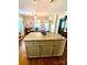 Kitchen island featuring granite counters, seating, and storage space at 101 Keswick Ln, Mooresville, NC 28117