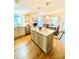 A bright kitchen with stainless steel appliances, granite counters, a kitchen island, and a dining nook at 101 Keswick Ln, Mooresville, NC 28117