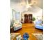 Living room featuring hardwood floors, vaulted ceilings, comfortable seating, and a ceiling fan at 101 Keswick Ln, Mooresville, NC 28117