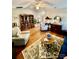 Inviting living room features hardwood floors, a decorative rug, and plenty of seating at 101 Keswick Ln, Mooresville, NC 28117