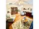 Inviting living room features hardwood floors, a decorative rug, and plenty of seating at 101 Keswick Ln, Mooresville, NC 28117