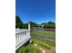 Relaxing pond view with water feature, visible from the deck with white railings at 101 Keswick Ln, Mooresville, NC 28117
