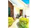 Close-up of a welcoming front porch with seating, lush landscaping, and charming decor at 101 Keswick Ln, Mooresville, NC 28117