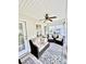 Relaxing sunroom with ceiling fan, decorative rug, and neutral-colored furnishings at 101 Keswick Ln, Mooresville, NC 28117