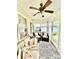 Cozy sunroom with abundant natural light and comfortable seating at 101 Keswick Ln, Mooresville, NC 28117