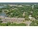 Stunning aerial view of lakefront condos with lush greenery and a community pool for a resort-like living experience at 104 Pier 33 Dr # 312, Mooresville, NC 28117