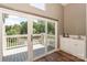 View from the open sliding glass doors to the balcony and a peek at the wet bar at 104 Pier 33 Dr # 312, Mooresville, NC 28117