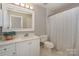 A bathroom featuring a tub/shower combo, vanity, and commode at 104 Pier 33 Dr # 312, Mooresville, NC 28117