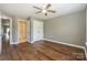 Bedroom with beautiful floors, ceiling fan, closet and ensuite bathroom entrance at 104 Pier 33 Dr # 312, Mooresville, NC 28117