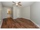 A secondary bedroom with a ceiling fan, wood-look floors, and access to the bathroom at 104 Pier 33 Dr # 312, Mooresville, NC 28117