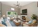 Cozy living room with a fireplace, ceiling fan, and comfortable seating arrangement at 104 Pier 33 Dr # 312, Mooresville, NC 28117