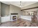 Spacious living room with a fireplace, wet bar and access to the kitchen area at 104 Pier 33 Dr # 312, Mooresville, NC 28117