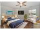 A well-decorated primary bedroom that has a big-screen television and seating area at 104 Pier 33 Dr # 312, Mooresville, NC 28117