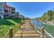 Picturesque waterfront walkway next to condos, offering serene lake views and easy access to boat docks at 104 Pier 33 Dr # 312, Mooresville, NC 28117