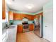 Well-lit kitchen with stainless steel appliances, granite countertops, and a modern faucet at 10408 Milstead Ct, Charlotte, NC 28215