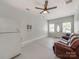 The living room has a couch, refrigerator, and windows at 10408 Milstead Ct, Charlotte, NC 28215
