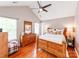 Tranquil main bedroom with a vaulted ceiling, hardwood floors, and abundant natural light at 10408 Milstead Ct, Charlotte, NC 28215