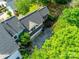 Aerial view of the home highlighting the backyard and large driveway with mature landscaping at 117 Mills Ln, Fort Mill, SC 29708