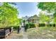 Backyard view showcasing the screened-in porch and lush landscaping at 117 Mills Ln, Fort Mill, SC 29708