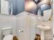 Charming half bath featuring wainscoting and a pedestal sink at 117 Mills Ln, Fort Mill, SC 29708