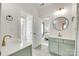 Dual-sink bathroom with stylish cabinets and fixtures, connecting to the bedroom, natural light at 117 Mills Ln, Fort Mill, SC 29708