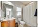 Well-maintained bathroom with a single vanity, toilet, and shower with tile floor at 117 Mills Ln, Fort Mill, SC 29708
