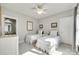 Comfortable bedroom with two twin beds, neutral paint, carpet, and natural light at 117 Mills Ln, Fort Mill, SC 29708