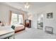 Sunlit bedroom with a writing desk, and easy access to the ensuite bath at 117 Mills Ln, Fort Mill, SC 29708