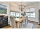 Charming dining area with large windows, a stylish light fixture, and comfortable seating at 117 Mills Ln, Fort Mill, SC 29708