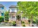 Charming two-story home featuring a welcoming front porch and well-manicured landscaping at 117 Mills Ln, Fort Mill, SC 29708