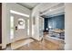 Elegant foyer with hardwood floors, white trim, and a view into the office at 117 Mills Ln, Fort Mill, SC 29708