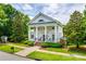 Stately home with large white columns, a spacious front porch, and professionally landscaped grounds at 117 Mills Ln, Fort Mill, SC 29708