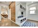 Mud room/hallway featuring a built-in storage bench and a rustic wood-paneled wall at 117 Mills Ln, Fort Mill, SC 29708