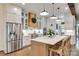 Modern kitchen featuring white cabinets, stainless steel appliances, and a large island at 117 Mills Ln, Fort Mill, SC 29708
