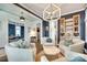 Beautiful living room featuring hardwood floors, modern lighting, and neutral decor at 117 Mills Ln, Fort Mill, SC 29708
