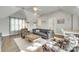 Cozy living room with hardwood floors, modern decor, sofa, and natural light at 117 Mills Ln, Fort Mill, SC 29708