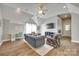 A cozy living room with neutral paint, modern furniture, ceiling fan, and bright window at 117 Mills Ln, Fort Mill, SC 29708