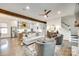Open living room showcasing wood beams, fireplace, and seamless flow into the kitchen at 117 Mills Ln, Fort Mill, SC 29708