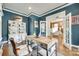 Well-lit home office featuring hardwood floors, navy walls, and french doors at 117 Mills Ln, Fort Mill, SC 29708
