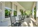 Spacious porch featuring rocking chairs and views of the greenery at 117 Mills Ln, Fort Mill, SC 29708