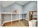 A clean and well-lit storage room with wood vinyl flooring and a built-in shelf at 117 Mills Ln, Fort Mill, SC 29708