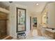 Luxurious bathroom with walk-in shower, soaking tub, double sinks and stylish fixtures at 12028 Royal Lytham Ct, Charlotte, NC 28277