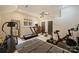 Well-equipped home gym featuring a treadmill, exercise bike, and free weights at 12028 Royal Lytham Ct, Charlotte, NC 28277