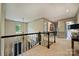 Bright hallway with natural light and elegant railings, featuring neutral color palette and ample space at 12028 Royal Lytham Ct, Charlotte, NC 28277