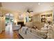 Cozy living room with a fireplace, built-in cabinets, and hardwood floors at 12028 Royal Lytham Ct, Charlotte, NC 28277